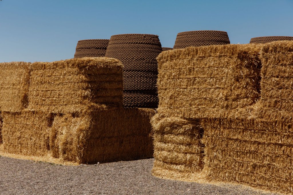 Hay bales in front of the Skylos at the Frontier Drive-Inn